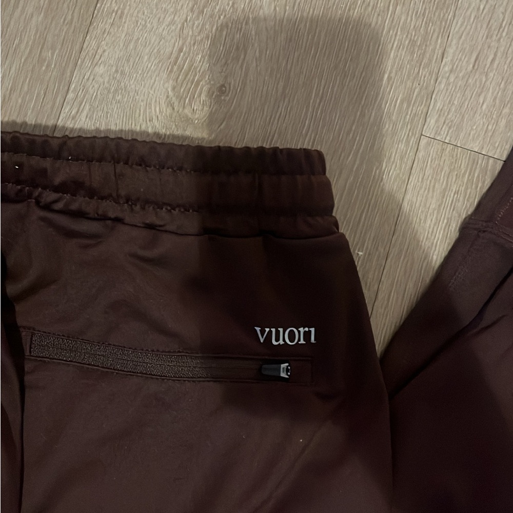 Vuori Men's Sunday Performance Joggers in a brown/oxblood color. - Picture 2 of 5